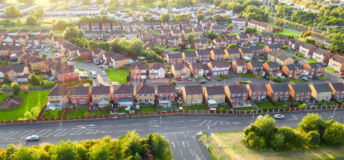 UK residential. An aerial view of a housing estate on the outskirts of the city of Glasgow, Scotland.